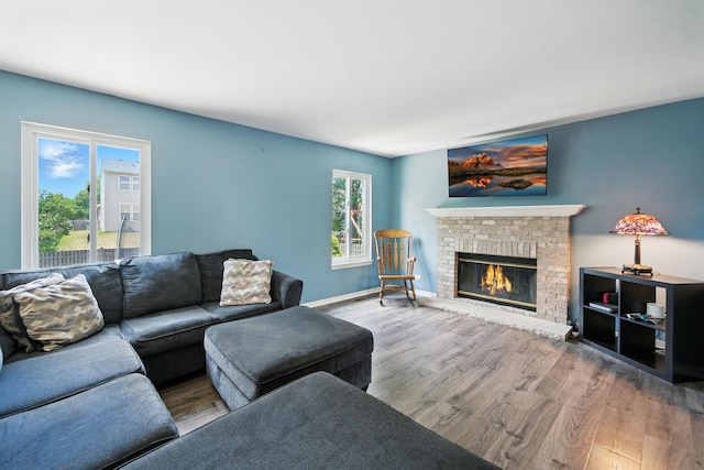 2942 Heather Ln, Montgomery, IL 60538 - living area featuring wood finished floors and a brick fireplace