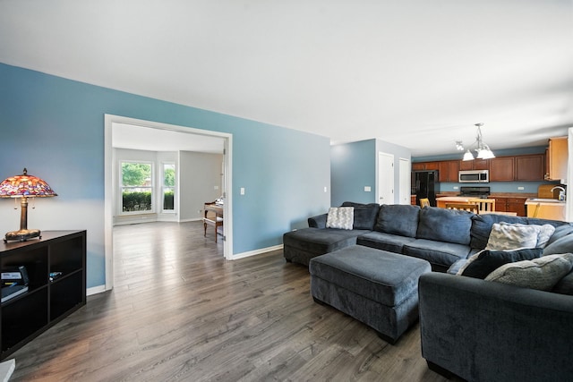 2942 Heather Ln, Montgomery, IL 60538 - living room with dark wood finished floors and a chandelier