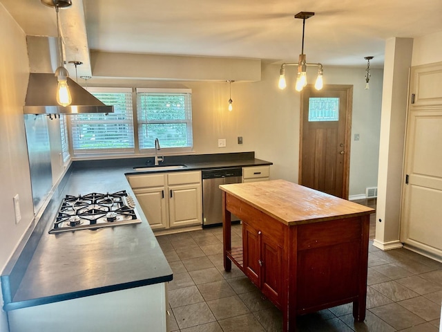 219 Spring Ave, Naperville, IL 60540 - kitchen with stainless steel appliances, wooden counters, dark tile patterned flooring, a kitchen island, and hanging light fixtures