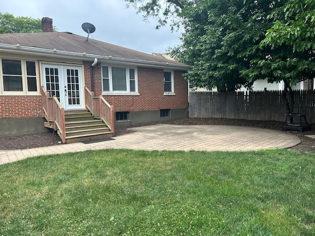 219 Spring Ave, Naperville, IL 60540 - back of property featuring brick siding, entry steps, a patio, a chimney, and french doors