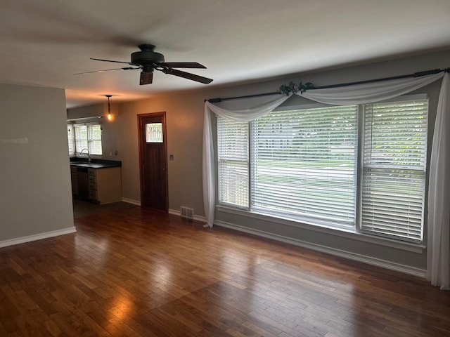 219 Spring Ave, Naperville, IL 60540 - unfurnished living room featuring ceiling fan and dark wood finished floors