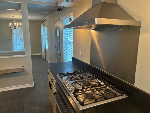 219 Spring Ave, Naperville, IL 60540 - kitchen featuring wall chimney exhaust hood, dark tile patterned flooring, stainless steel gas stovetop, a chandelier, and white cabinetry