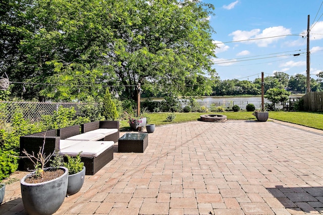 443 W Water St, Kankakee, IL 60901 - fenced backyard featuring a patio area and an outdoor living space with a fire pit