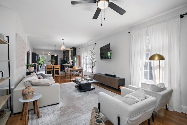 443 W Water St, Kankakee, IL 60901 - living room with a chandelier, a ceiling fan, and wood finished floors
