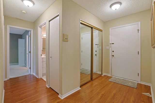 1501 Woodbridge Rd Unit 3E, Joliet, IL 60436 - entrance foyer featuring a textured ceiling and light wood-style floors