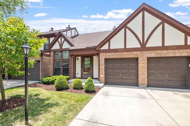 3050 Ashton Ct, Westchester, IL 60154 - tudor home featuring brick siding, driveway, stucco siding, and a garage