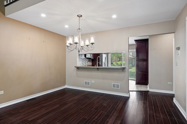 3050 Ashton Ct, Westchester, IL 60154 - unfurnished dining area with a chandelier, wood finished floors, and recessed lighting
