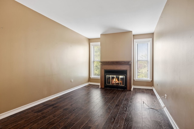 3050 Ashton Ct, Westchester, IL 60154 - unfurnished living room featuring dark wood-type flooring and a glass covered fireplace