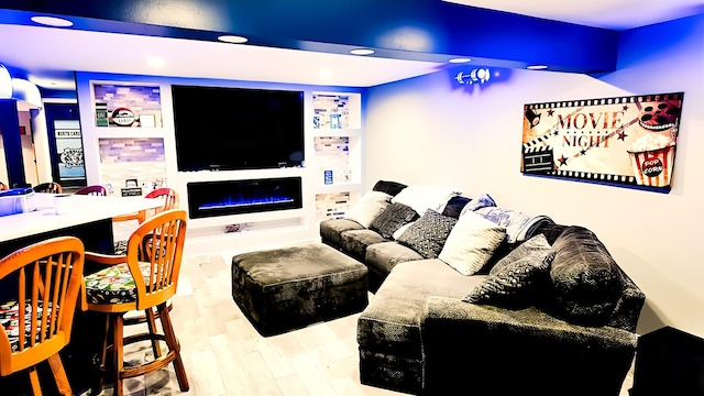 3113 Meadowsedge Ln, Joliet, IL 60436 - home theater with wood finished floors, recessed lighting, and a warm lit fireplace
