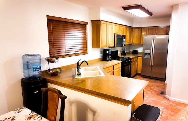 3113 Meadowsedge Ln, Joliet, IL 60436 - kitchen featuring appliances with stainless steel finishes, a peninsula, light tile patterned flooring, and a breakfast bar area