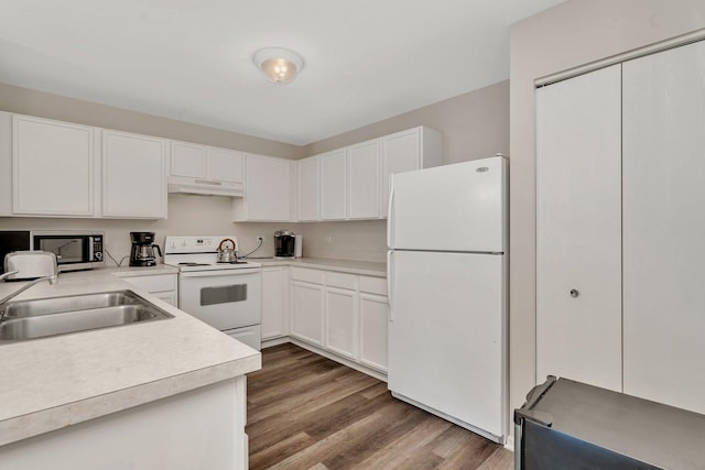 1303 Silverstone Dr Unit 1303, Carpentersville, IL 60110 - kitchen featuring white appliances, under cabinet range hood, light countertops, wood finished floors, and white cabinets