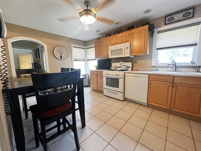 8544 Lawler Ave, Burbank, IL 60459 - kitchen featuring white appliances, plenty of natural light, light countertops, and arched walkways