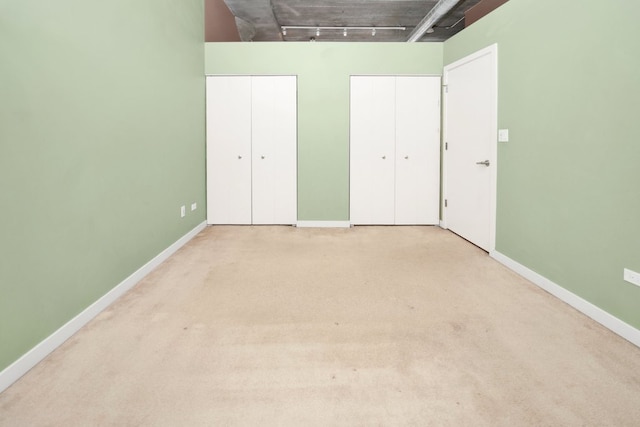 1151 W 15th St Unit 336, Chicago, IL 60608 - unfurnished bedroom with two closets and carpet