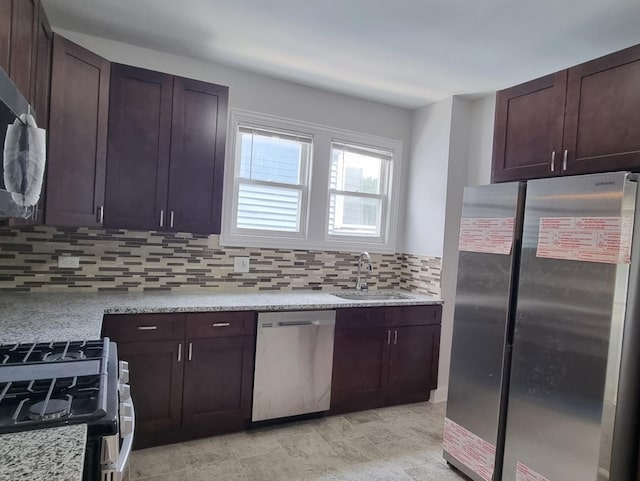 kitchen featuring stainless steel appliances, decorative backsplash, and dark brown cabinets