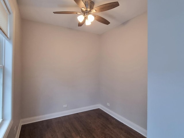 unfurnished room with ceiling fan and dark wood finished floors