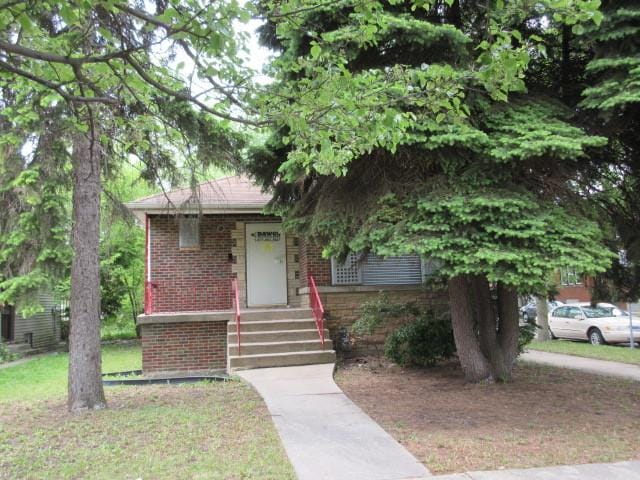 7700 S Ada St, Chicago, IL 60620 - view of front facade featuring brick siding