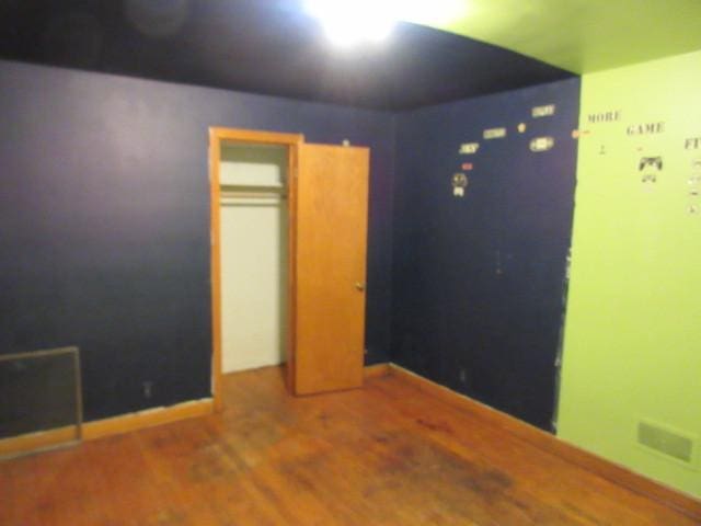 7700 S Ada St, Chicago, IL 60620 - unfurnished bedroom with wood finished floors and baseboards