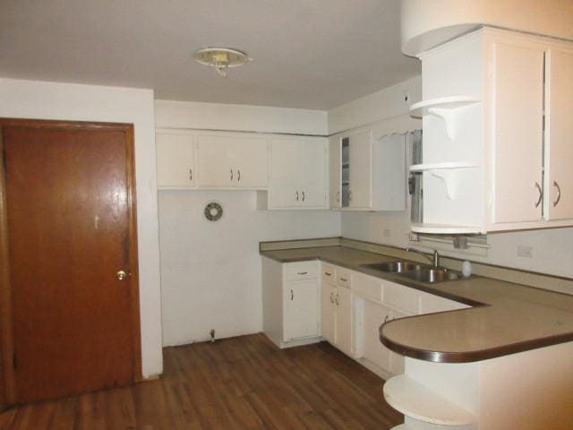 7700 S Ada St, Chicago, IL 60620 - kitchen featuring white cabinetry, dark wood-style flooring, and a peninsula