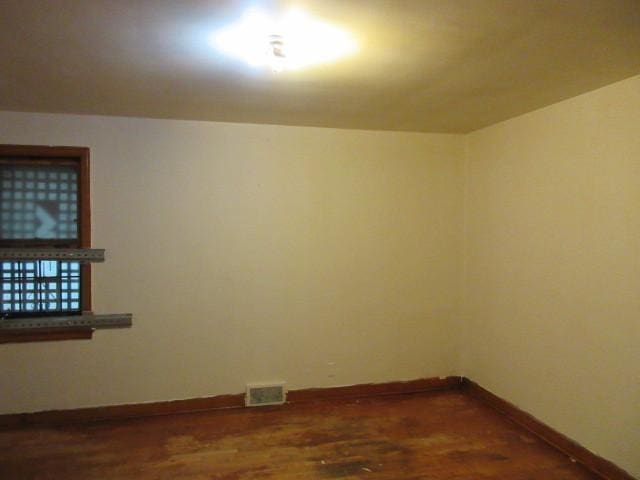 7700 S Ada St, Chicago, IL 60620 - empty room with baseboards and dark wood-style floors