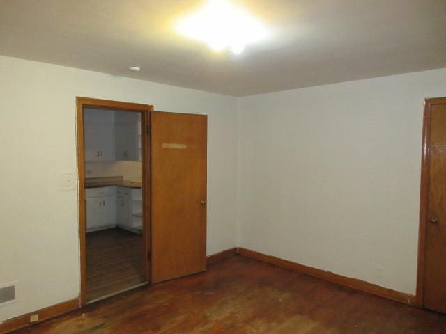 7700 S Ada St, Chicago, IL 60620 - unfurnished bedroom featuring wood finished floors and a closet