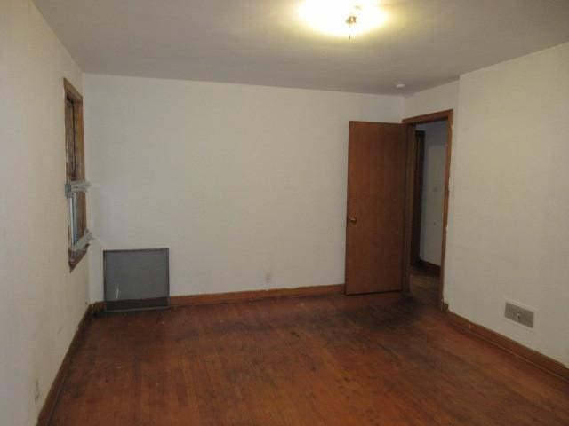 7700 S Ada St, Chicago, IL 60620 - spare room featuring wood finished floors and baseboards