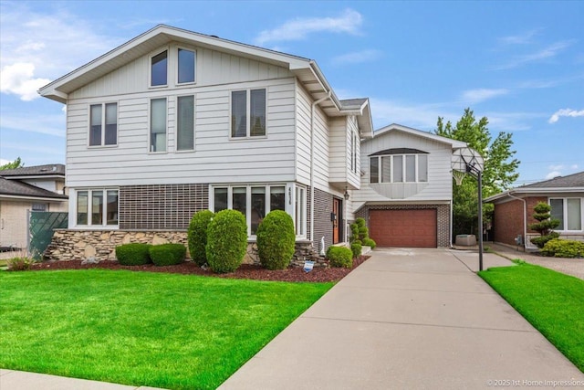 4616 W 105th Pl, Oak Lawn, IL 60453 - view of front of property with concrete driveway, a front yard, an attached garage, and stone siding