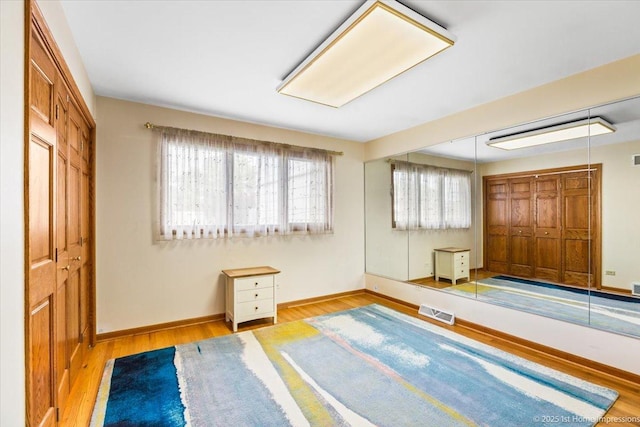 4616 W 105th Pl, Oak Lawn, IL 60453 - unfurnished bedroom featuring wood finished floors and a closet
