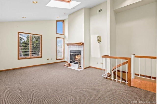 4616 W 105th Pl, Oak Lawn, IL 60453 - unfurnished living room featuring a skylight, carpet flooring, a tile fireplace, high vaulted ceiling, and recessed lighting
