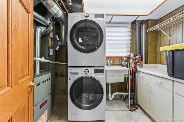 4616 W 105th Pl, Oak Lawn, IL 60453 - laundry room featuring stacked washer and clothes dryer and a sink