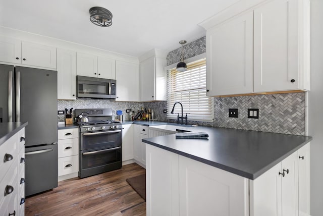 235 Parktrail Ct, Schaumburg, IL 60173 - kitchen featuring appliances with stainless steel finishes, dark countertops, and white cabinets