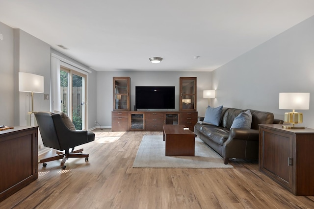 235 Parktrail Ct, Schaumburg, IL 60173 - living area with light wood-style flooring and baseboards