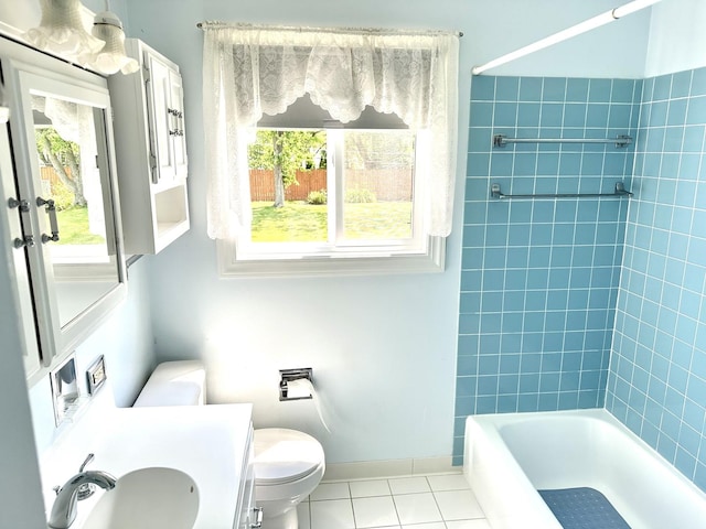 36429 N Edgewood Dr, Gurnee, IL 60031 - bathroom featuring tile patterned flooring, healthy amount of natural light, vanity, and shower / washtub combination