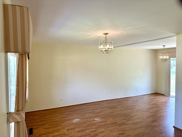 36429 N Edgewood Dr, Gurnee, IL 60031 - empty room featuring a chandelier and dark wood-style flooring