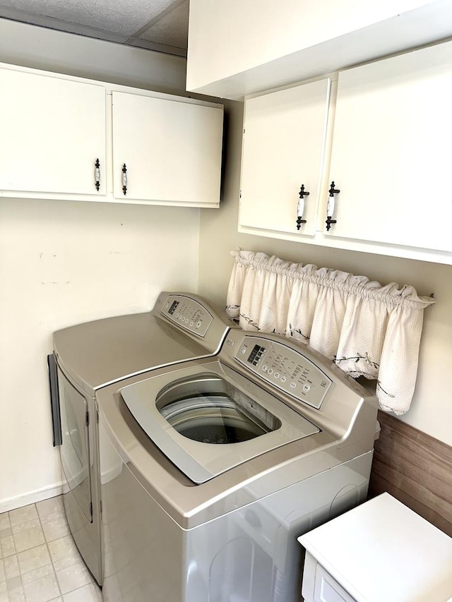36429 N Edgewood Dr, Gurnee, IL 60031 - laundry room with cabinet space, washer and dryer, and light tile patterned flooring