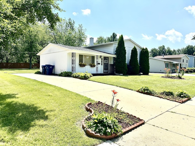 36429 N Edgewood Dr, Gurnee, IL 60031 - split level home with a front lawn and a chimney