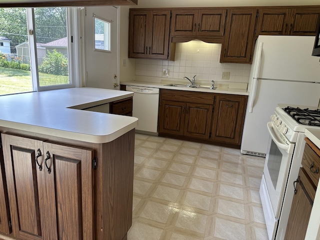 36429 N Edgewood Dr, Gurnee, IL 60031 - kitchen with white appliances, light flooring, light countertops, tasteful backsplash, and a kitchen island