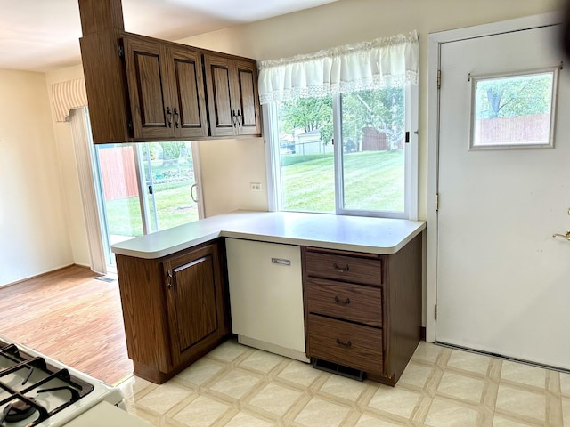 36429 N Edgewood Dr, Gurnee, IL 60031 - kitchen with light countertops, light flooring, dark brown cabinets, and refrigerator