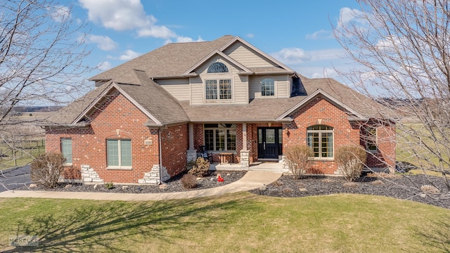 9299 Lee Hill Rd, Newark, IL 60541 - traditional-style home with brick siding, roof with shingles, a front lawn, and a porch