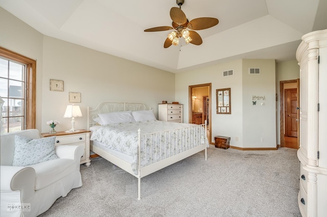 9299 Lee Hill Rd, Newark, IL 60541 - bedroom featuring light carpet, vaulted ceiling, ensuite bath, ceiling fan, and a tray ceiling
