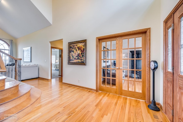 9299 Lee Hill Rd, Newark, IL 60541 - entrance foyer featuring french doors, wood finished floors, high vaulted ceiling, and stairs
