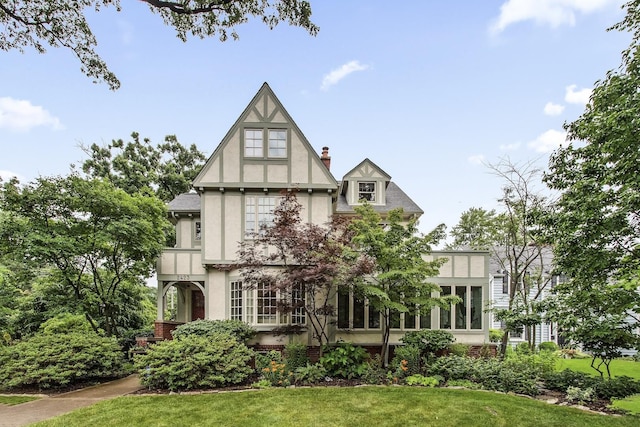 2423 Harrison St, Evanston, IL 60201 - tudor house with stucco siding and a front yard