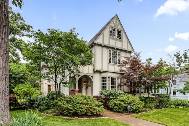 2423 Harrison St, Evanston, IL 60201 - tudor home featuring stucco siding and a front lawn