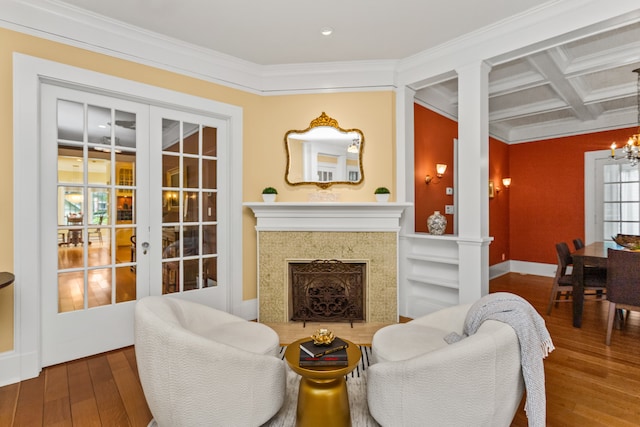 2423 Harrison St, Evanston, IL 60201 - living room with hardwood / wood-style flooring, french doors, a chandelier, crown molding, and coffered ceiling