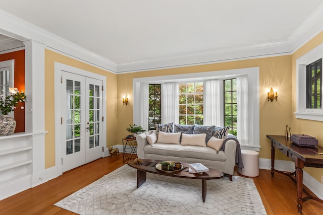 2423 Harrison St, Evanston, IL 60201 - living room with french doors, wood finished floors, and crown molding
