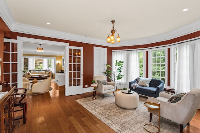 2423 Harrison St, Evanston, IL 60201 - living area featuring crown molding, hardwood / wood-style floors, a chandelier, recessed lighting, and french doors
