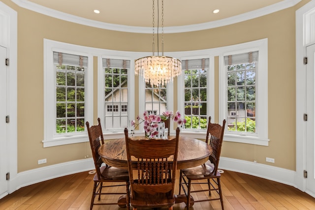 2423 Harrison St, Evanston, IL 60201 - dining area featuring a chandelier, wood-type flooring, ornamental molding, and healthy amount of natural light