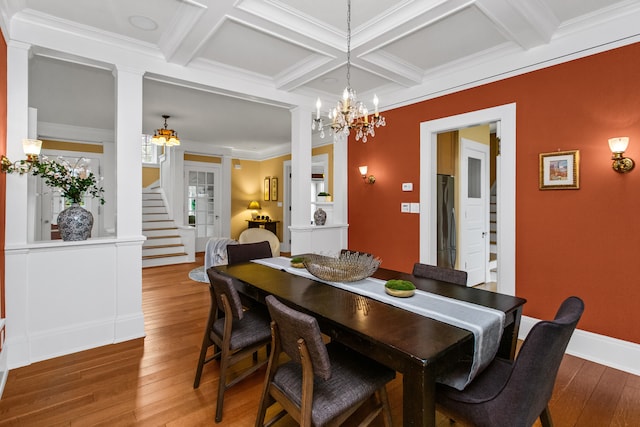 2423 Harrison St, Evanston, IL 60201 - dining area with decorative columns, coffered ceiling, wood-type flooring, a chandelier, and beam ceiling