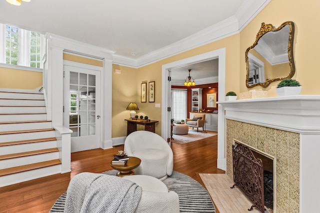 2423 Harrison St, Evanston, IL 60201 - sitting room with hardwood / wood-style flooring, stairway, crown molding, and a fireplace with flush hearth
