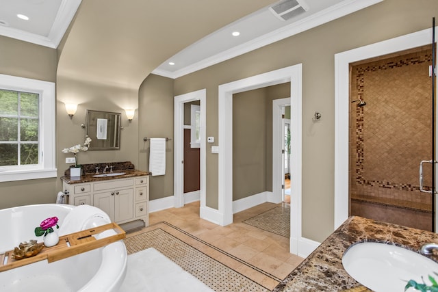 2423 Harrison St, Evanston, IL 60201 - full bath with ornamental molding, vanity, a freestanding tub, a shower stall, and recessed lighting