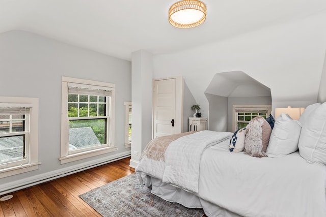 2423 Harrison St, Evanston, IL 60201 - bedroom featuring wood-type flooring, a baseboard radiator, and lofted ceiling